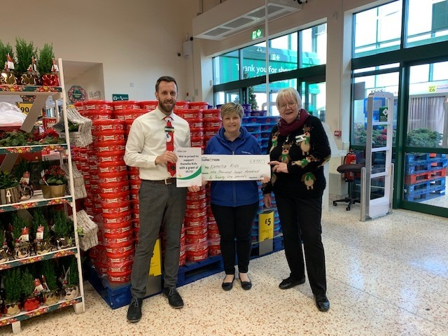 Suzanne, the Nursery Manager, being presented with the cheque by Morrisons